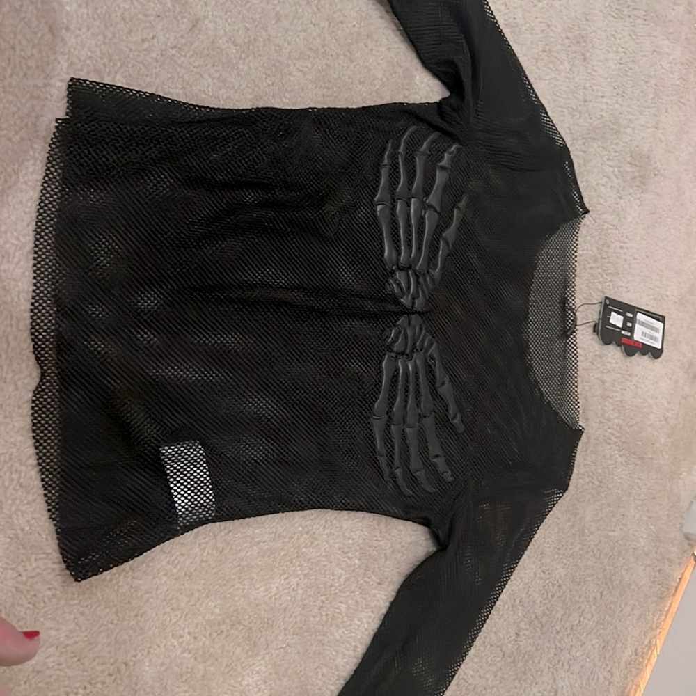 Black fishnet with skeleton hands in front